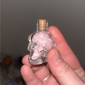 Skull-Shaped Glass Bottle with Rose Quartz Chips